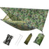 A camouflage double camping hammock with an attached mosquito net and a camouflage rain fly tarp suspended above it is shown. Below are the included accessories: black ropes, silver stakes, and two stuff sacks (one olive green, one camouflage).