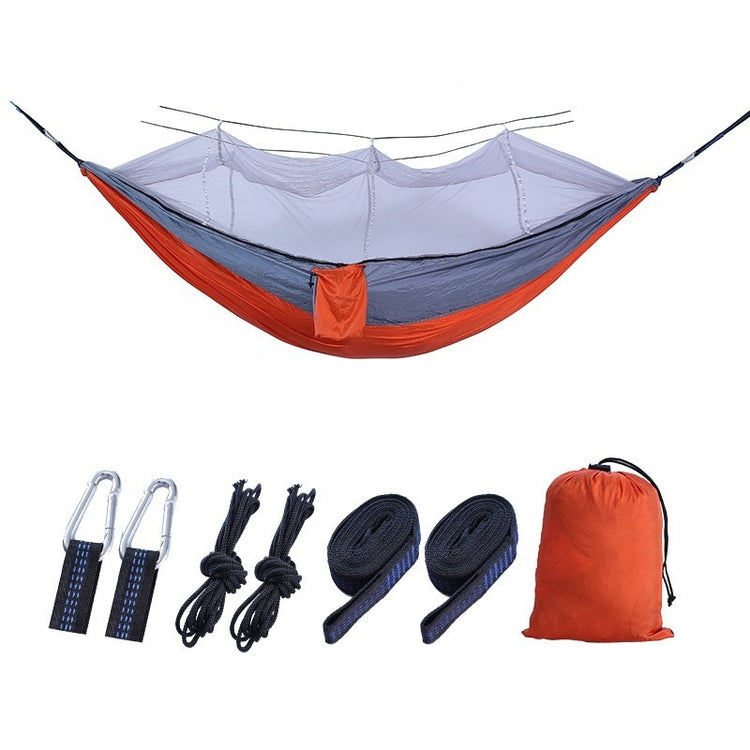 A double camping hammock made of dark green and fruit green fabric with a white mosquito net suspended above it is shown against a white background. The text "Dark green with fruit green + white mesh" is below the hammock.