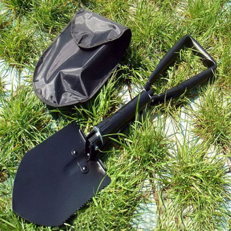 A carbon steel folding shovel, shown unfolded, with its carry pouch, highlighting its compact design and military-grade build.