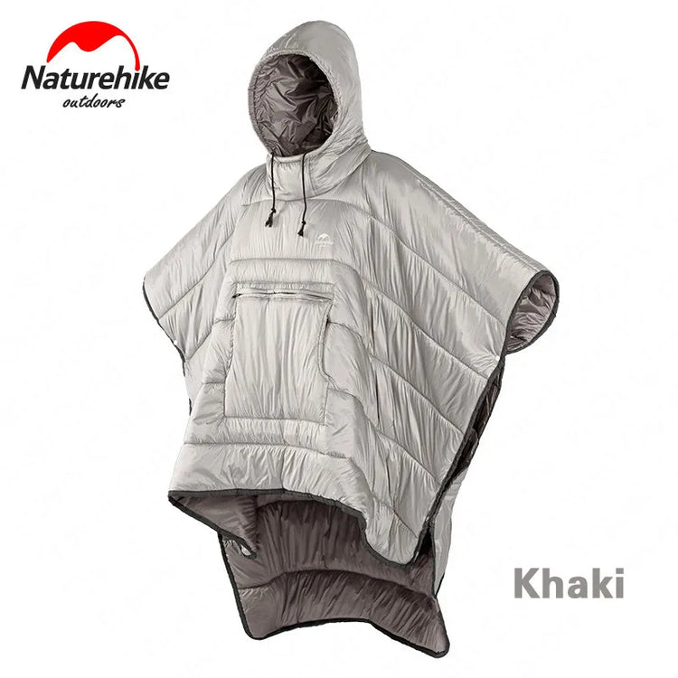 A khaki Naturehike wearable sleeping bag quilt, styled as a poncho with a hood and a large front pocket, is shown against a white background. The quilt has vertical baffles and the Naturehike logo is visible in the upper left. The text "Khaki" is printed in the lower right.