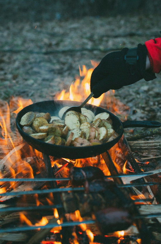 person cooking on wok