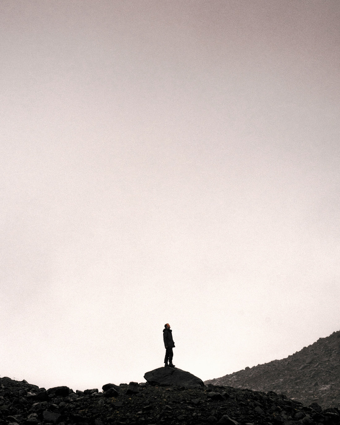 man standing on gray stone during daytime