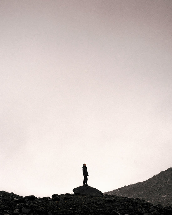 man standing on gray stone during daytime