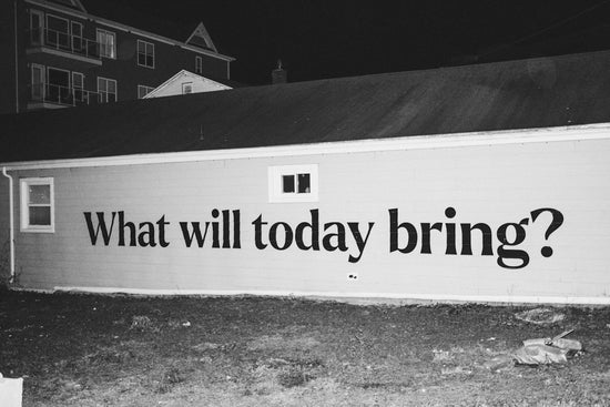 a black and white photo of a building with a sign that says what will today