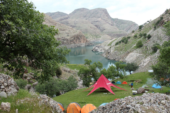 a tent set up on the side of a mountain