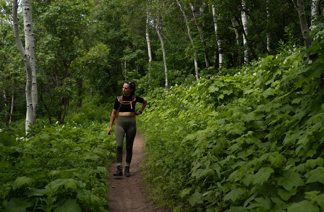 A person walking down a trail in the woods