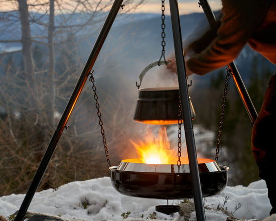 Someone is cooking over a campfire in winter.