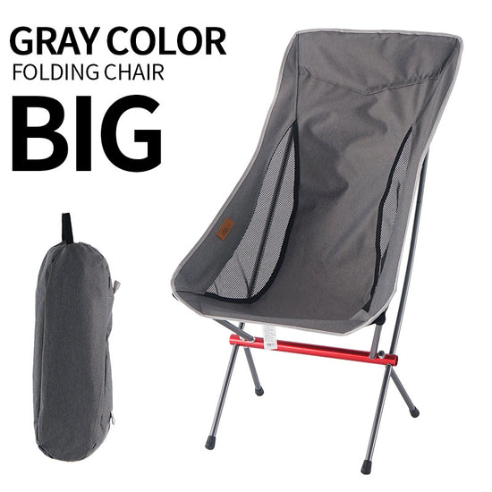 A black heightened folding moon chair is shown standing upright next to its black carrying bag against a white background. The chair has a black mesh seat and backrest with a red horizontal support bar on the aluminum frame. Text above the chair reads "BLACK COLOR FOLDING CHAIR BIG
