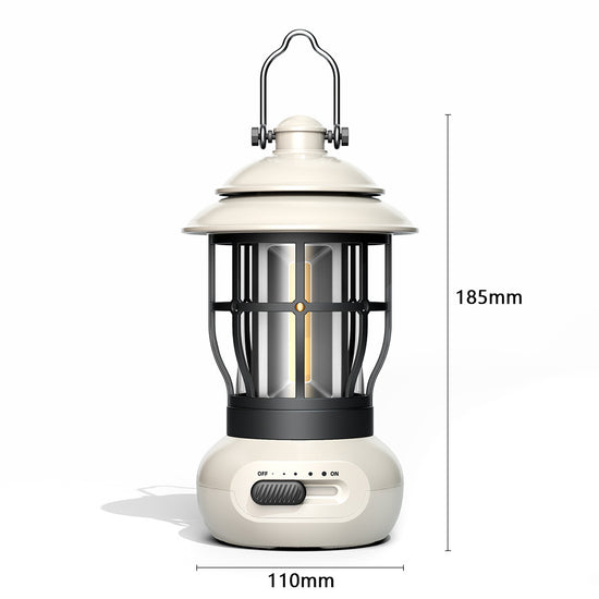 A vintage-style camping lantern with a white top and base, and a black protective cage around a cylindrical light source. A silver carrying handle extends from the top. To the right and below, dimensions "185mm" (height) and "110mm" (base diameter) are indicated. A slider switch on the base shows "OFF" and "ON" positions.