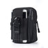 A black tactical waist bag with multiple pockets and straps is shown against a white background. A white smartphone is partially visible in an outer pocket, and a black pen is in a side loop. A black buckle closure is visible on the main flap.