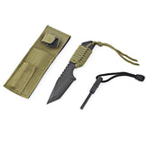 A black tanto knife with a green nylon cord-wrapped handle is shown next to an olive green nylon sheath with a flap closure and a small pocket on the front. A black fire starter with a black lanyard is positioned below the knife.