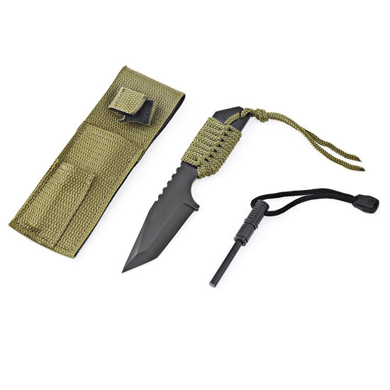 A black tanto knife with a green nylon cord-wrapped handle is shown next to an olive green nylon sheath with a flap closure and a small pocket on the front. A black fire starter with a black lanyard is positioned below the knife.