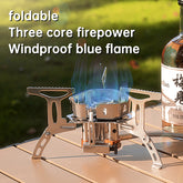 A 5800W 3-head camping gas stove, shown unfolded and folded, highlighting its stainless steel construction, electronic ignition, and conversion head