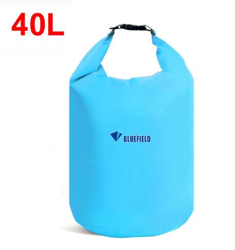 A light blue Bluefield 40L waterproof dry bag is shown against a white background. The bag is sealed at the top with a black buckle. The Bluefield logo is visible in the center. The text "40L" is in red at the top left.