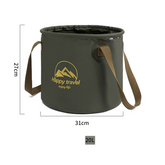 An olive green foldable bucket with brown carrying straps is shown against a white background with dimension markings indicating a height of 27cm and a diameter of 31cm. A gold logo with mountains and the text "Happy travel enjoy life" is printed on the side.