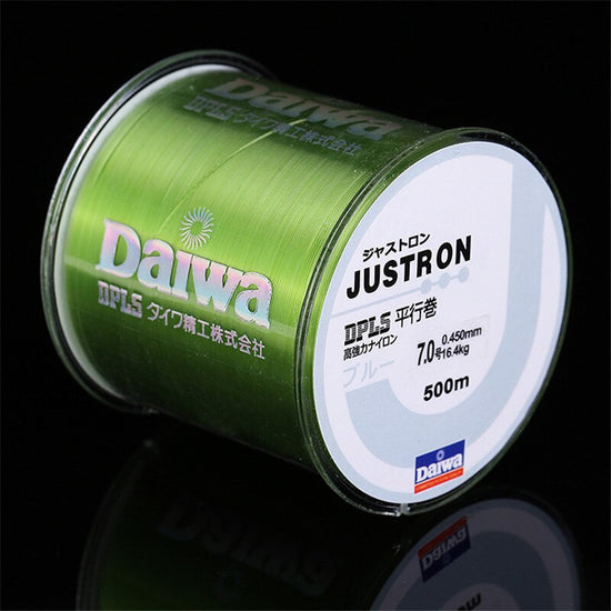 A large spool of light yellow nylon fishing line labeled with various specifications and branding.