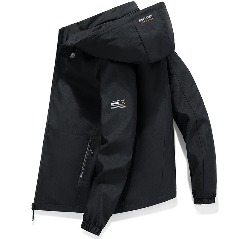 A black hooded windbreaker jacket for men with a partial zipper, a logo on the left sleeve, and lettering on the hood.