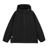A black hooded outdoor jacket with multiple visible zipper pockets is shown against a white background. The jacket has a full front zipper closure and adjustable cuffs.