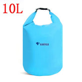 A light blue Bluefield 10L waterproof dry bag stands upright against a white background. The top of the bag is rolled and clipped shut with a black buckle. The Bluefield logo is printed in white on the lower portion of the bag. "10L" is visible in large red text in the upper left corner of the image.