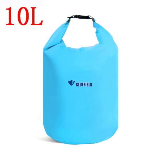 A light blue Bluefield 10L waterproof dry bag stands upright against a white background. The top of the bag is rolled and clipped shut with a black buckle. The Bluefield logo is printed in white on the lower portion of the bag. "10L" is visible in large red text in the upper left corner of the image.