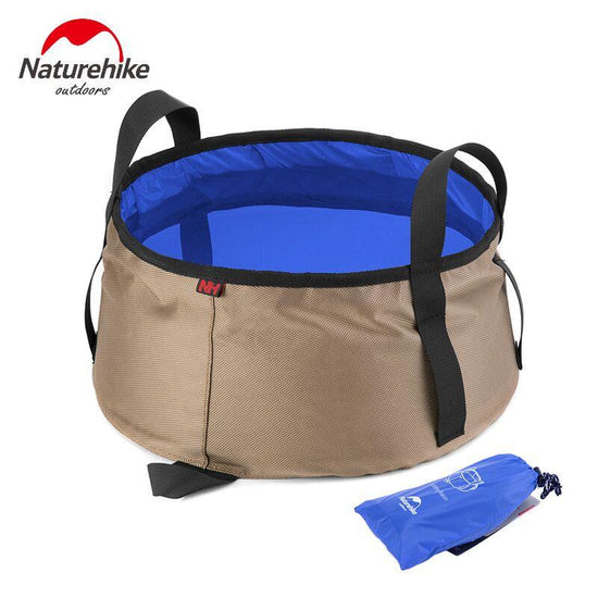 A tan-colored Naturehike 8.5L folding wash basin with black carrying straps and a blue waterproof interior is shown next to its blue storage pouch against a white background. The Naturehike logo is visible in the upper left corner of the image.