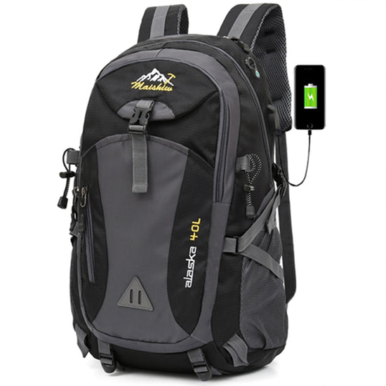 A black and gray 40L "Alaska" hiking backpack with adjustable straps and multiple pockets is shown against a white background. A logo with mountains and the text "Maiskiu" is visible on the top front pocket. The text "Alaska 40L" is printed vertically on the side in yellow.