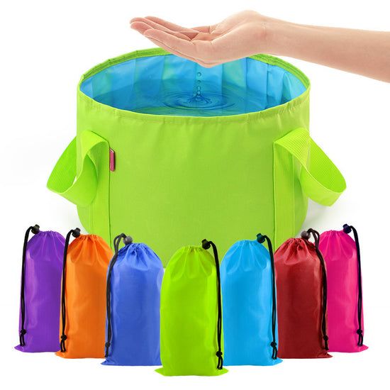 A bright green portable folding bucket with a light blue interior and two side handles is shown against a white background. A smaller, folded version of the bucket in its lime green drawstring storage bag is visible in the upper right corner.
