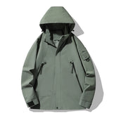  A black unisex waterproof windbreaker with a hood, a full front zipper, snap closures, and multiple visible zippered pockets is shown against a white background.