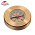 A small, round, gold-colored Naturehike compass is shown against a white background. The compass face features markings for direction (N, S, E, W) and degrees, with a black and red magnetic needle. The Naturehike Outdoors logo is visible in the upper left corner.