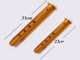 Two gold-colored, wide aluminum alloy sand tent pegs are shown against a light background, with dimensions indicating lengths of 31cm and 23cm. The "Deadfall Creations" logo is visible in the top right corner.
