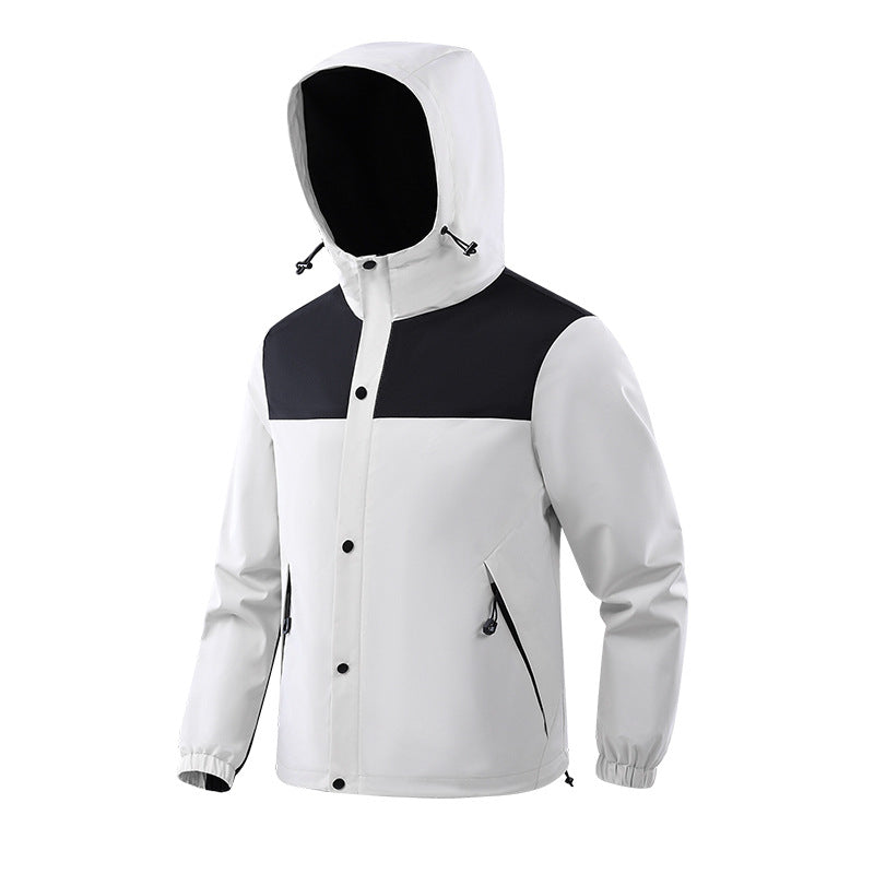 A black hooded outdoor jacket with a buttoned storm flap over the zipper and zippered side pockets.