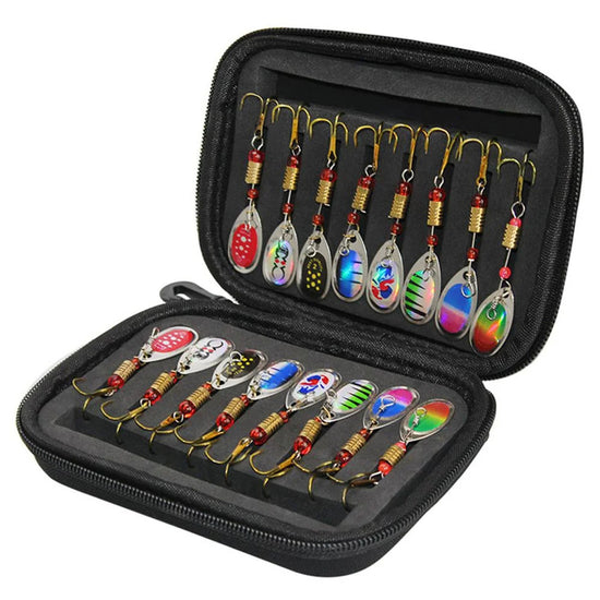 An open black zippered case with 16 colorful metal spoon spinner fishing lures neatly arranged in individual slots. Ten lures are visible in the top section, hanging from their hooks, and six more are laid out in the bottom section.