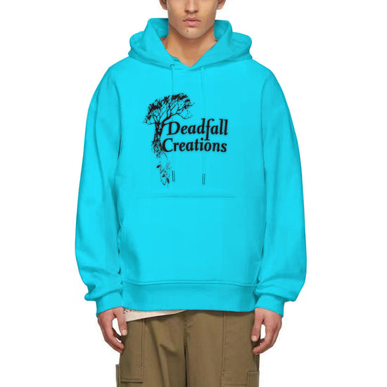 A man models a bright blue hoodie with the Deadfall Creations logo printed in black on the center chest. The logo features the text "Deadfall Creations" below a stylized image of a bare tree with roots extending downwards. The hoodie has a drawstring hood and a kangaroo front pocket.